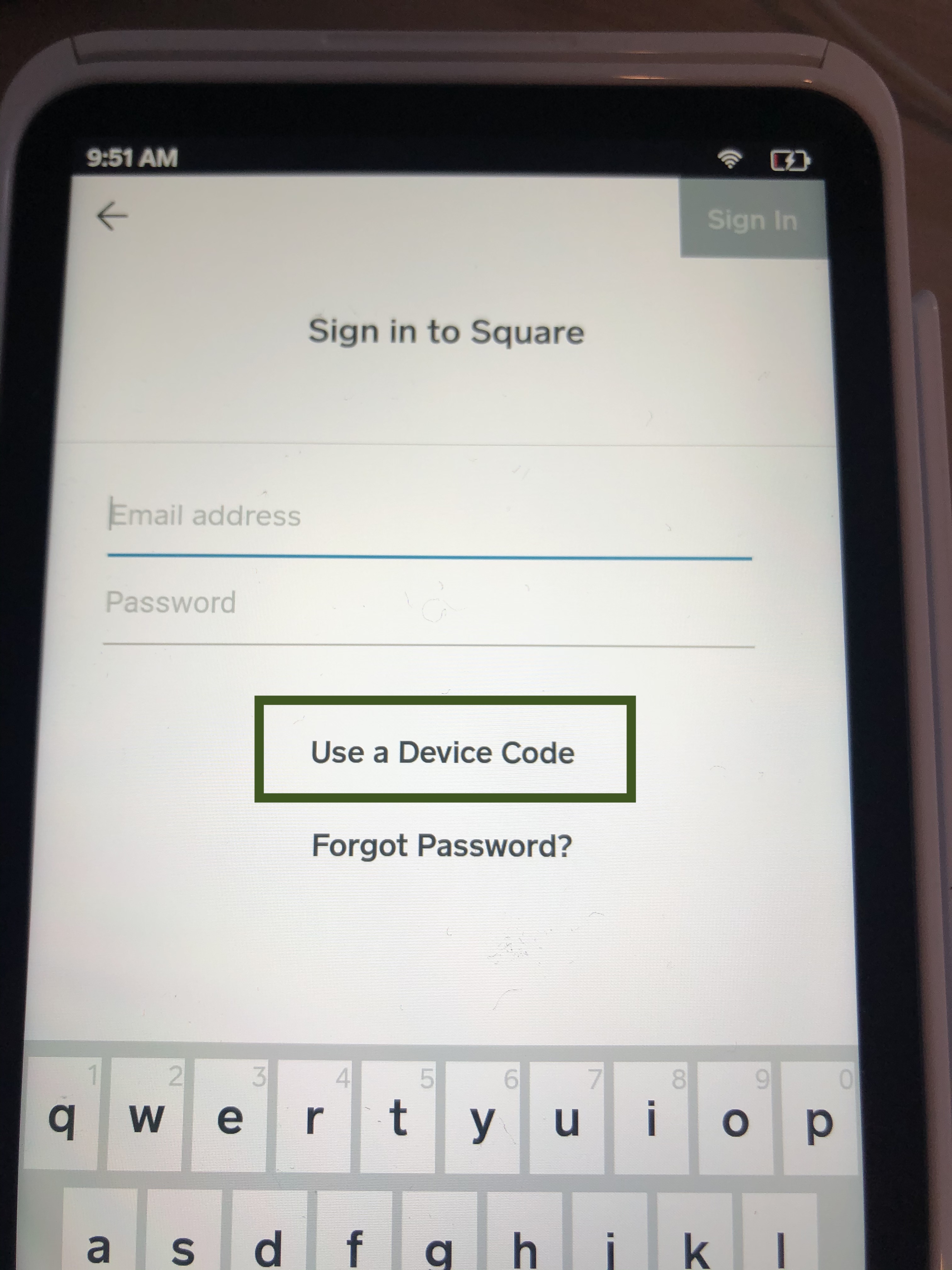 You will be presented with a Square login dialog. Click on the 'Use a device code' link